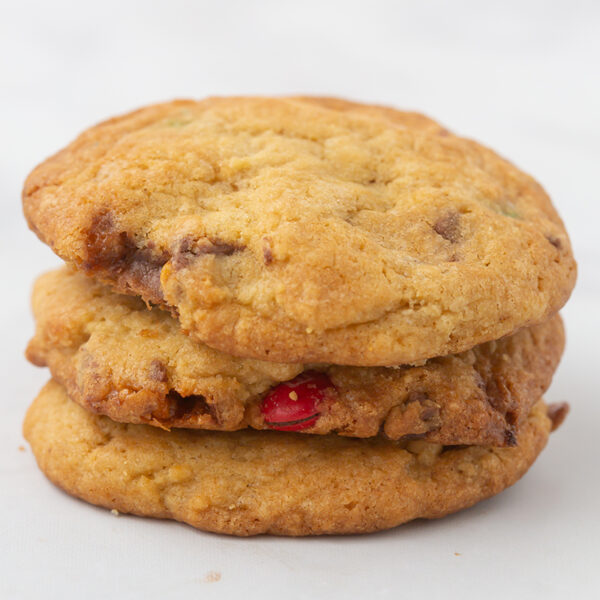 Image of 3 candy compost chocolate chip cookies stacked on one another. double shot espresso chocolate chip cookies