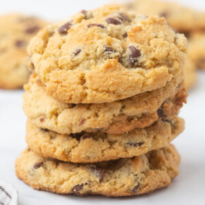 Image of 4 gluten free chocolate chip cookies stacked on one another.
