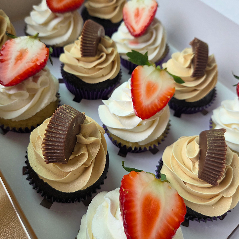 Gourmet cupcakes with buttercream frosting, strawberries, and chocolate for corporate catering orders in New Jersey